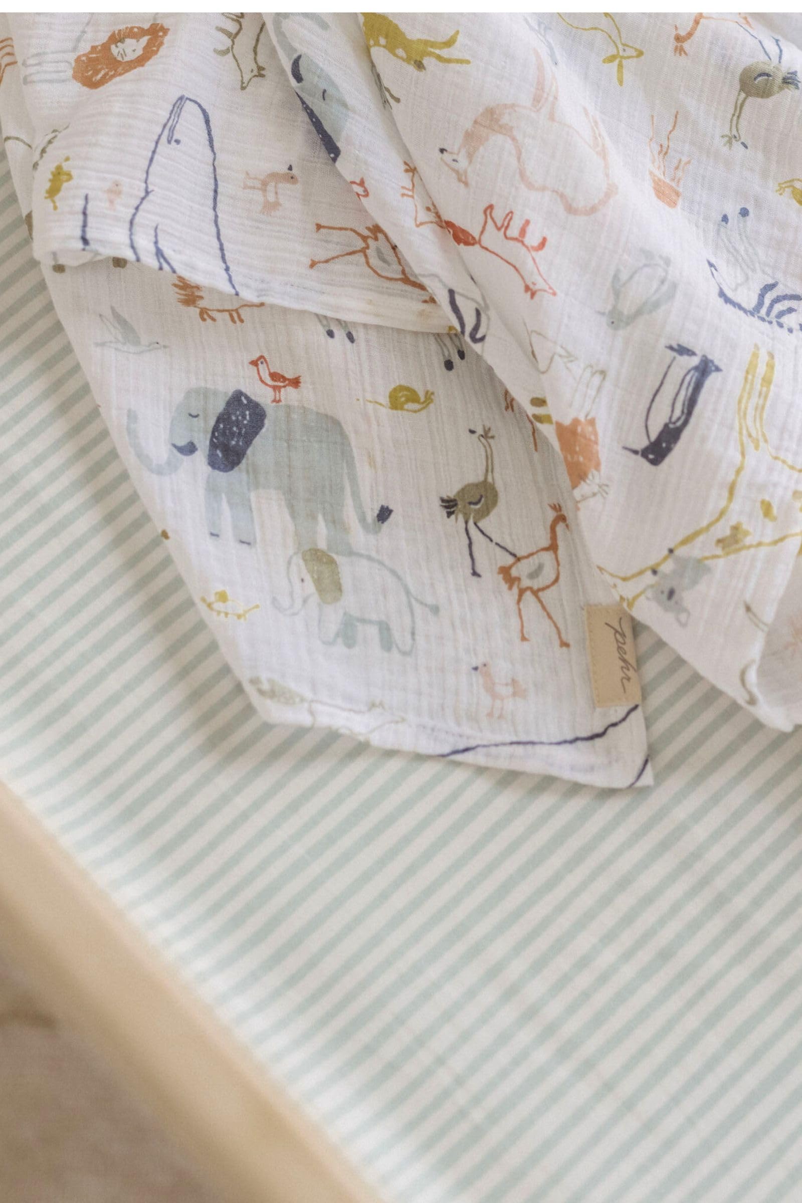 PEHR brushed organic cotton crib sheet highlights ultra-soft texture for baby comfort.