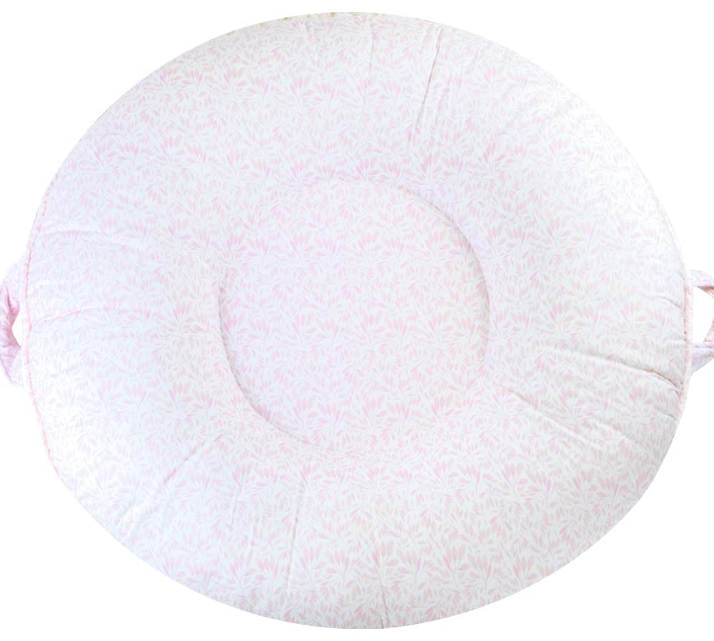 Pello multi-use baby floor pillow with soft center and raised sides for secure lounging