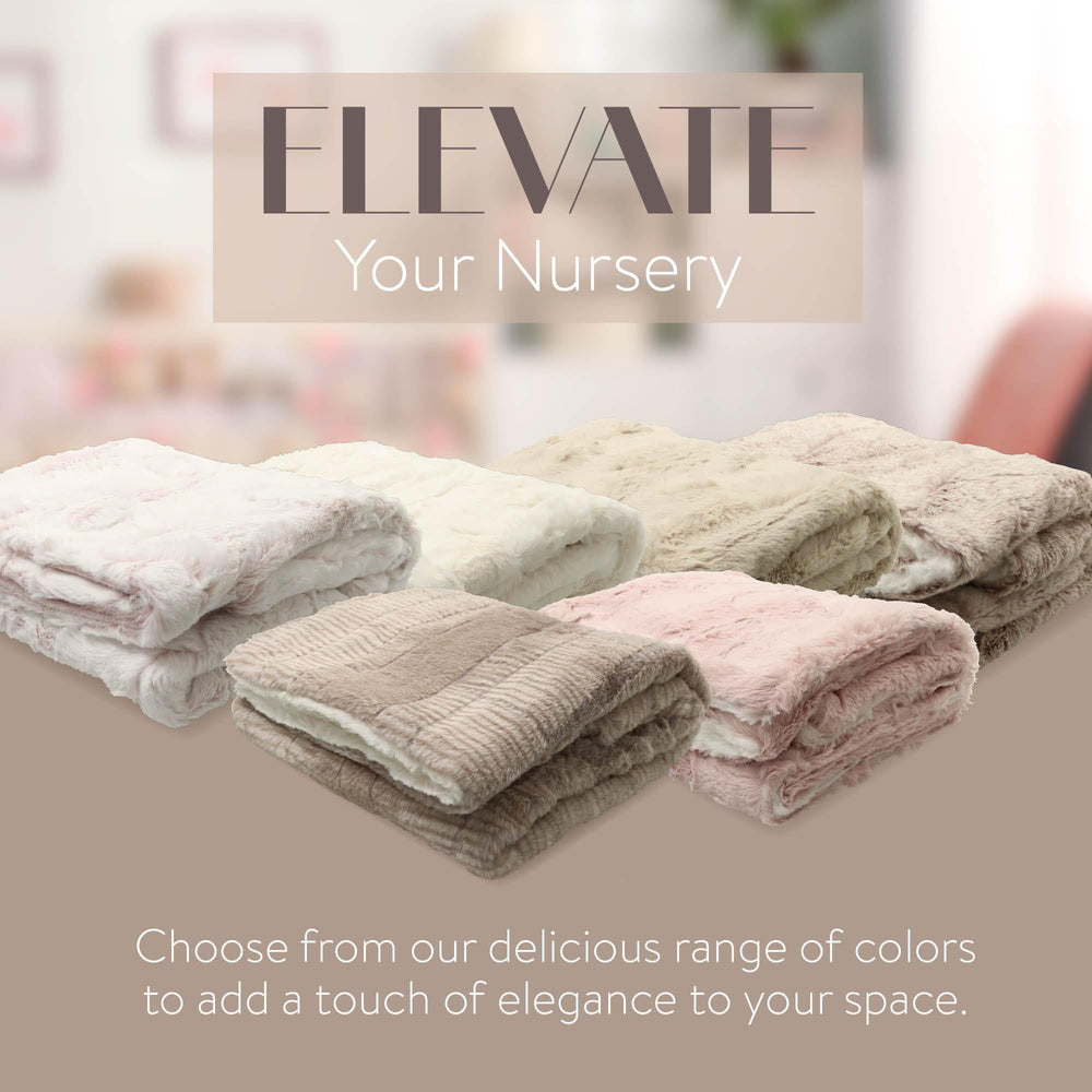 Peluche Lux faux fur baby blanket in cradle, enhances nursery warmth.
