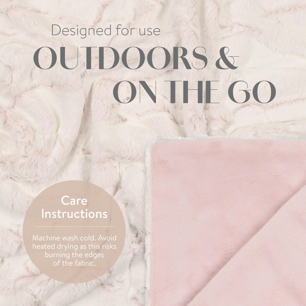 Peluche Lux faux fur baby blanket, oatmeal heather, swaddle scene for naptime.
