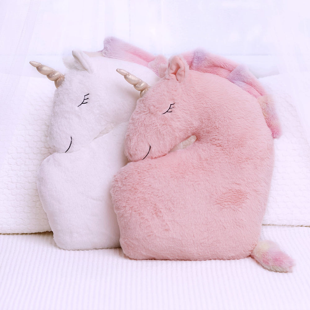 Perfectto Design unicorn pillow on a bed enhances princess room decor.
