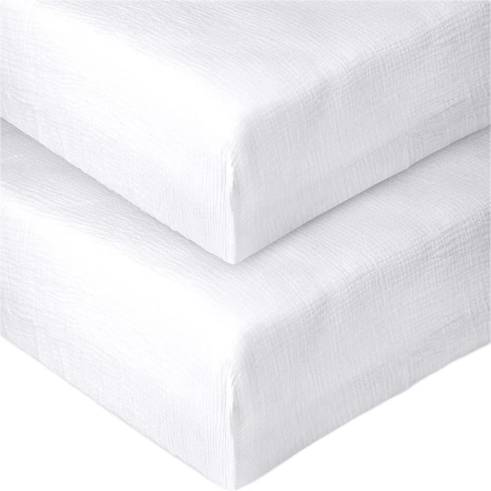 Pet Rejoir white muslin fitted crib sheet offers a soft, breathable sleep surface.