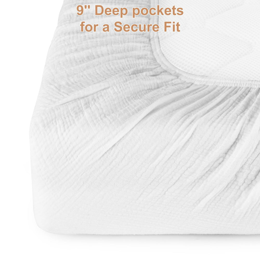Pet Rejoir white muslin crib sheets create a clean, breathable base.