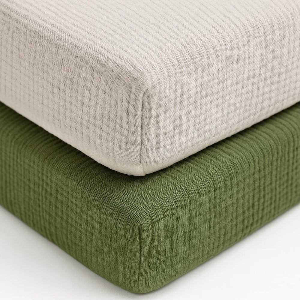 Pet Rejoir olive green muslin crib sheet on mattress for breathable comfort