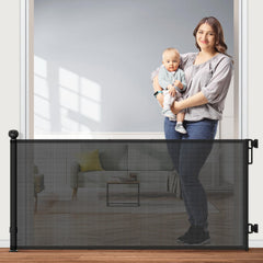 Petstars retractable gate mesh extended across doorway for pet and child safety