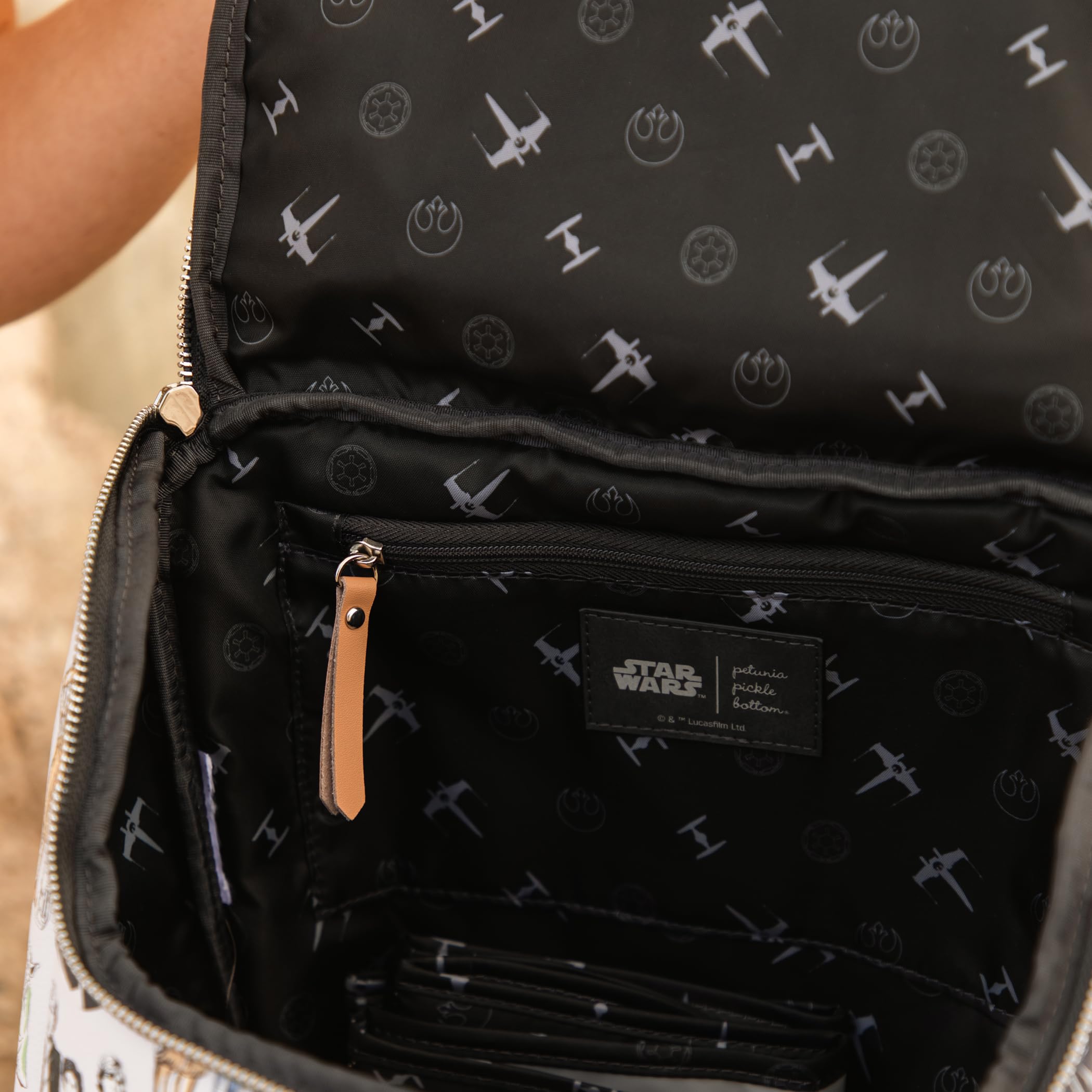 Petunia Pickle Bottom Method Backpack stroller clip supports hands-free outings.