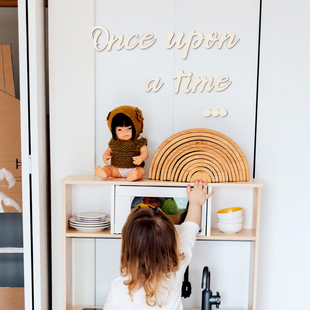 PEUTIER wall decor in a kids room, warm beige wood sign