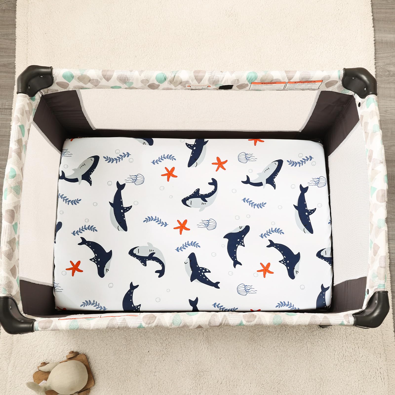 PHF mini crib sheet showing deep pocket and elastic for snug flat fit