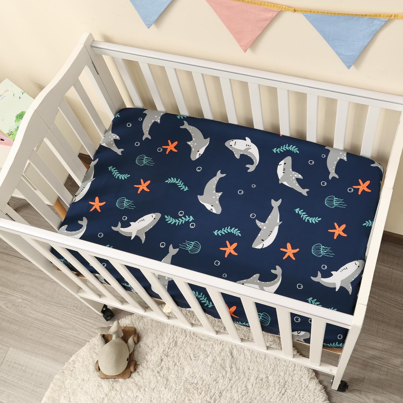 PHF shark pack N Play sheets in nursery setup supporting quick changes