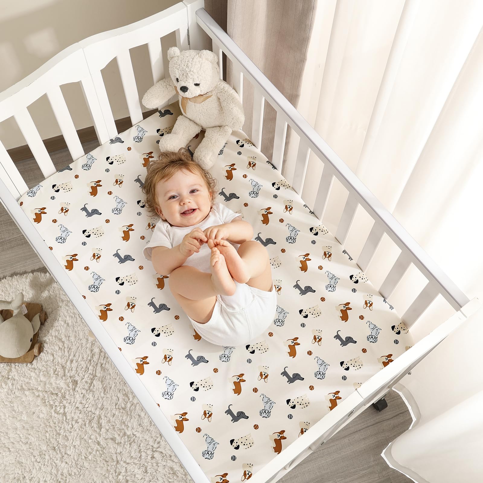 PHF three-pack pack n play sheets in dog designs.