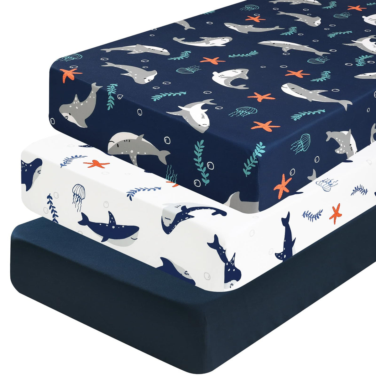 PHF shark crib sheet showing a snug 28x52 fit for standard cribs.