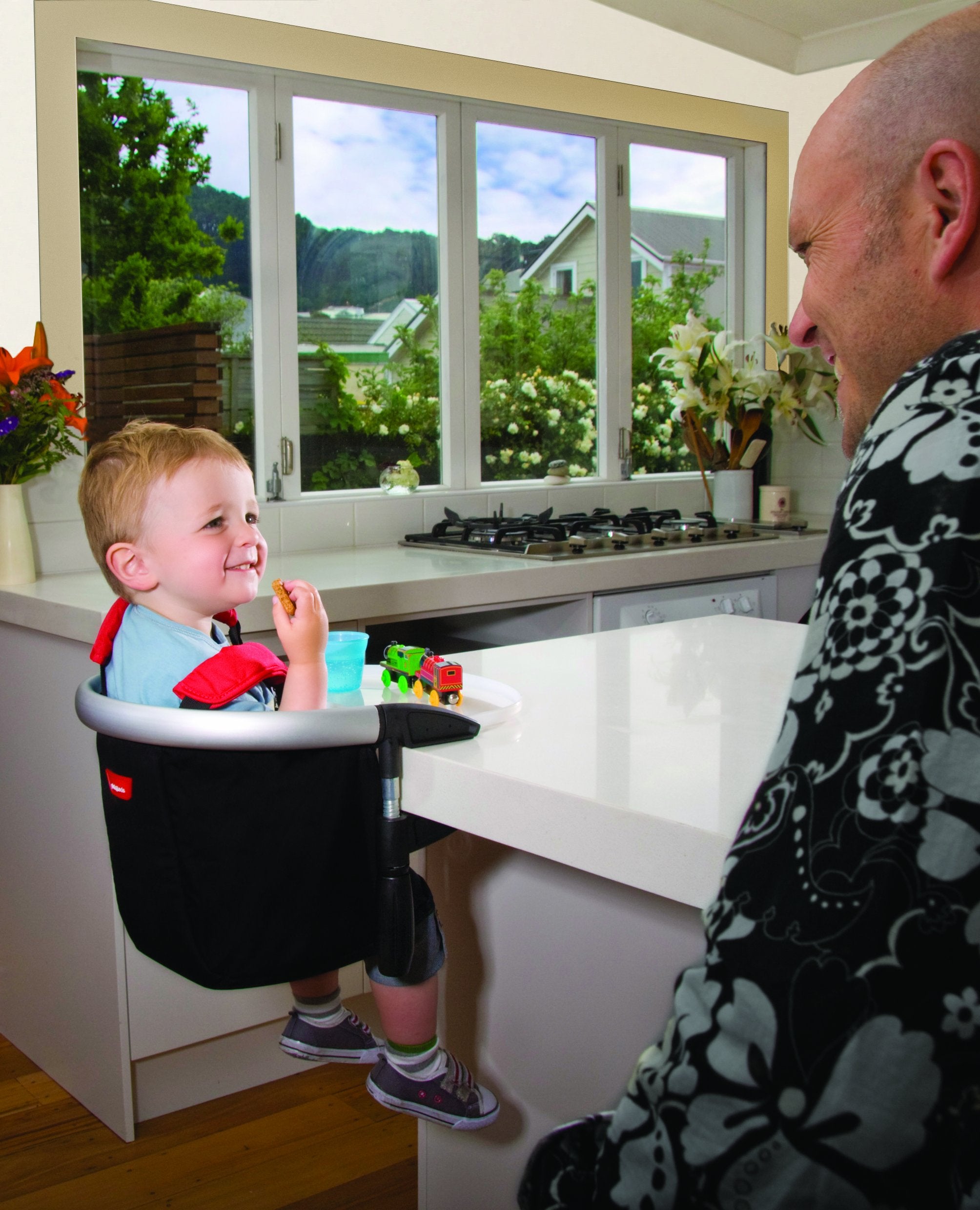 Phil-teds Lobster clip-on high chair dishwasher-safe tray protects surfaces.