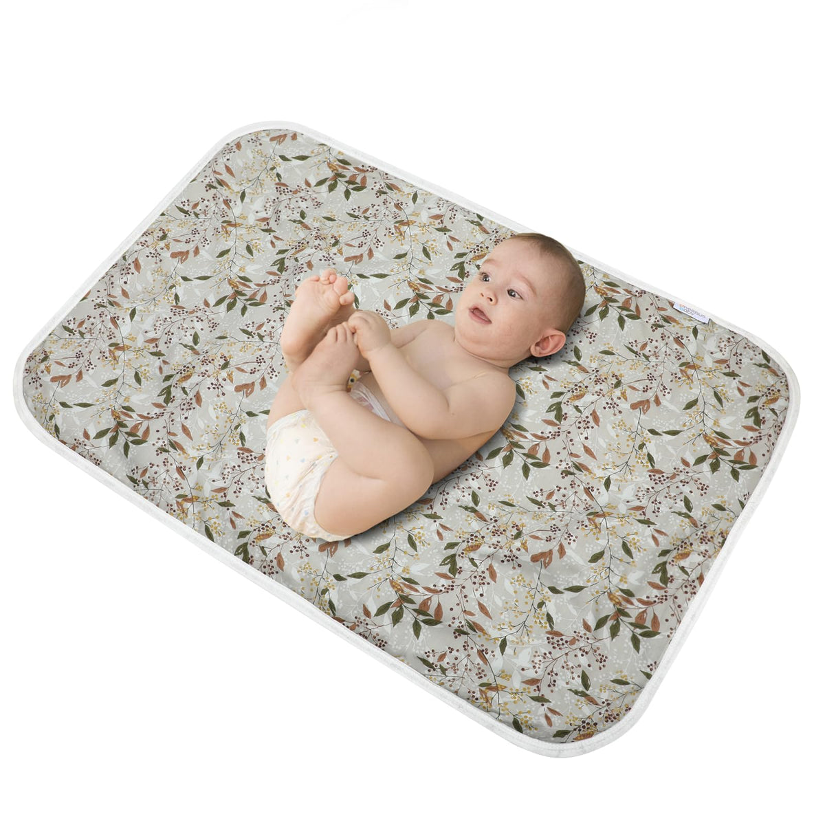 PHOEBUS BABY changing pad with leaf pattern on top offers a soft cotton surface.