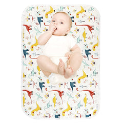 PHOEBUS BABY dinosaur changing pad top view shows soft cotton surface for gentle diaper changes.