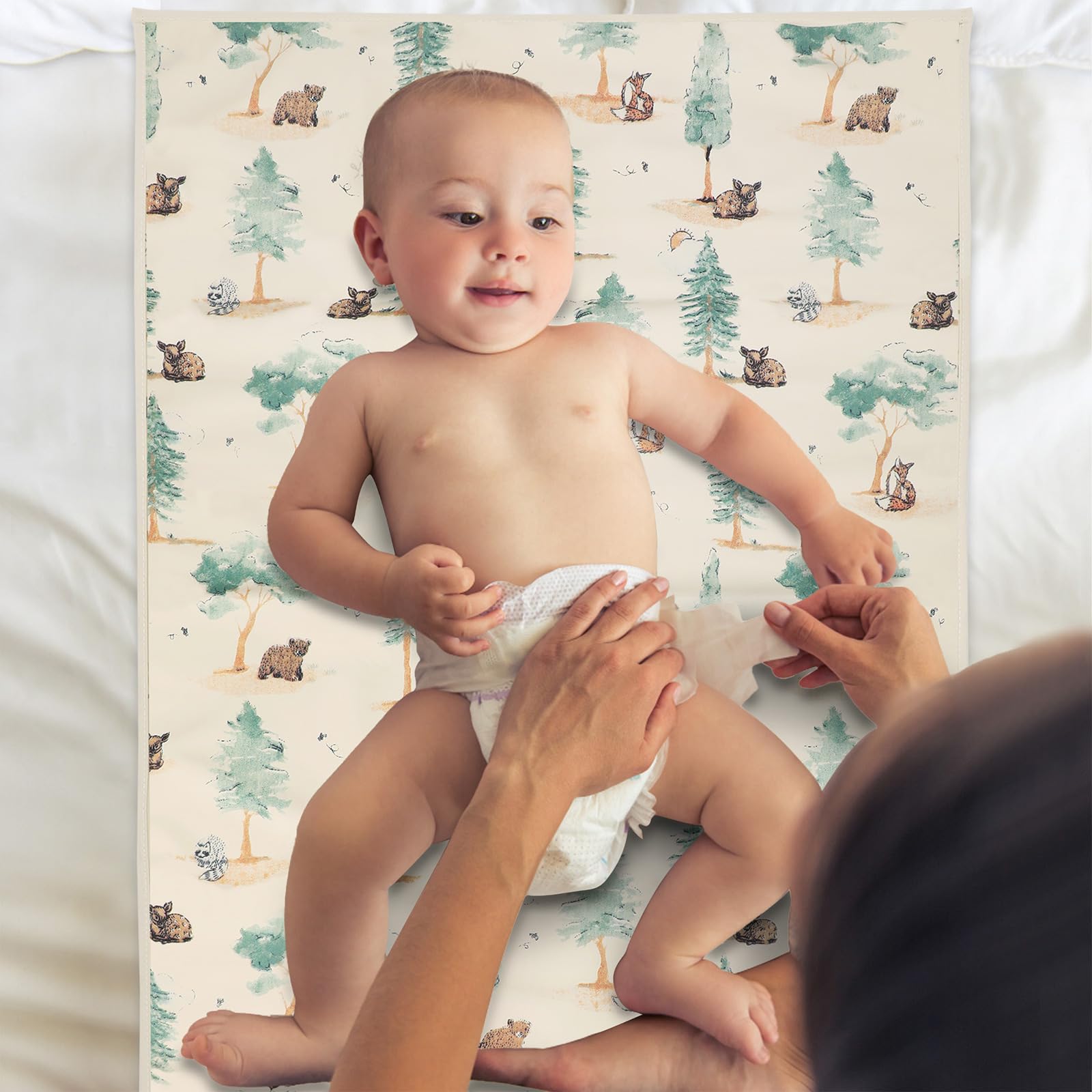 PHOEBUS BABY forest changing mat folded for compact travel.