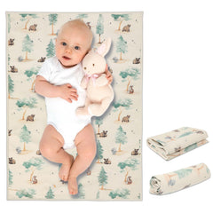 PHOEBUS BABY forest changing mat rolled for easy travel and storage.