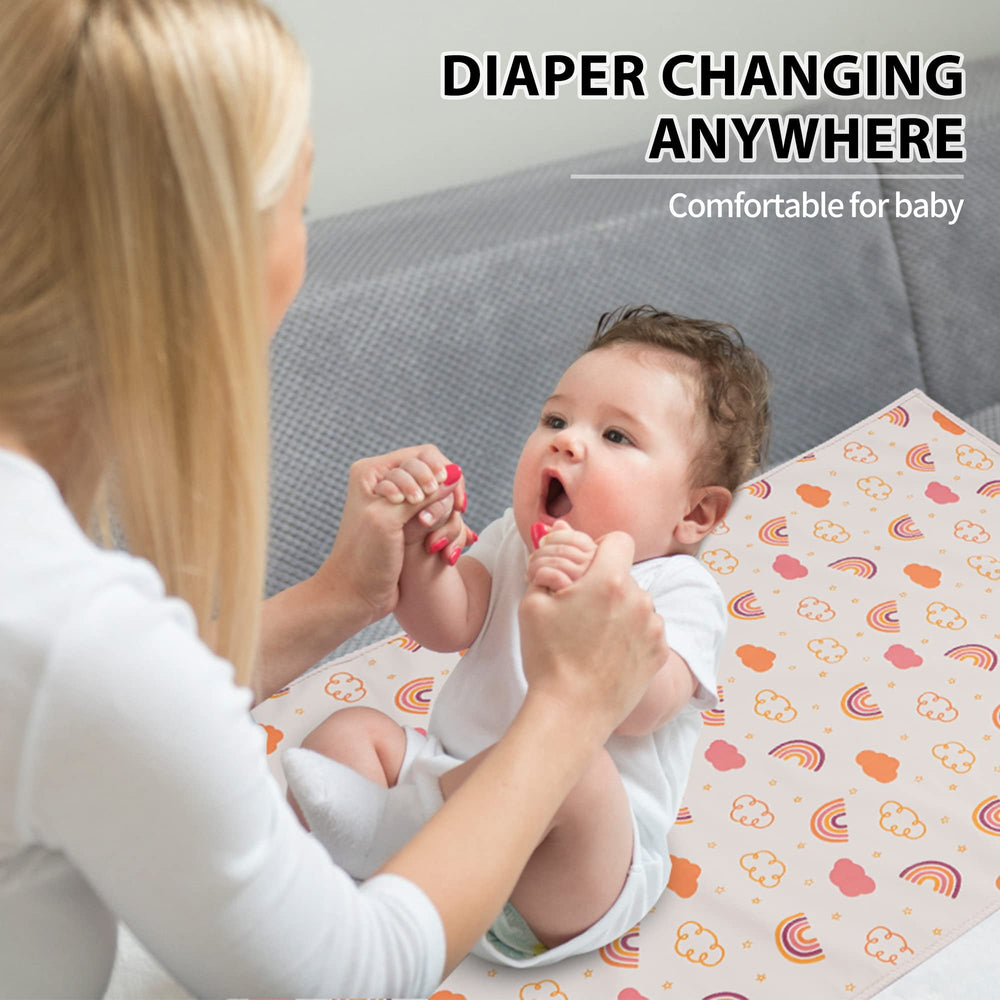 PHOEBUS BABY newborn essentials gift set with rainbow changing mat.