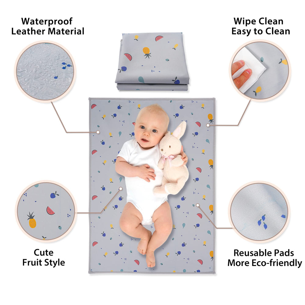Phoebus Baby fruit-pattern mat in vegan leather, folds compactly for travel and storage.