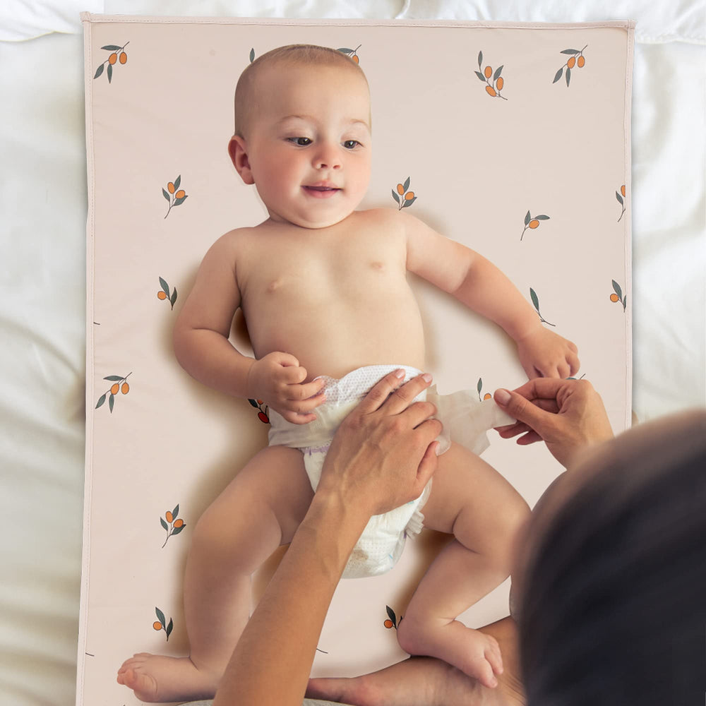 PHOEBUS BABY vegan leather changing mat in bed for safe, comfortable changes