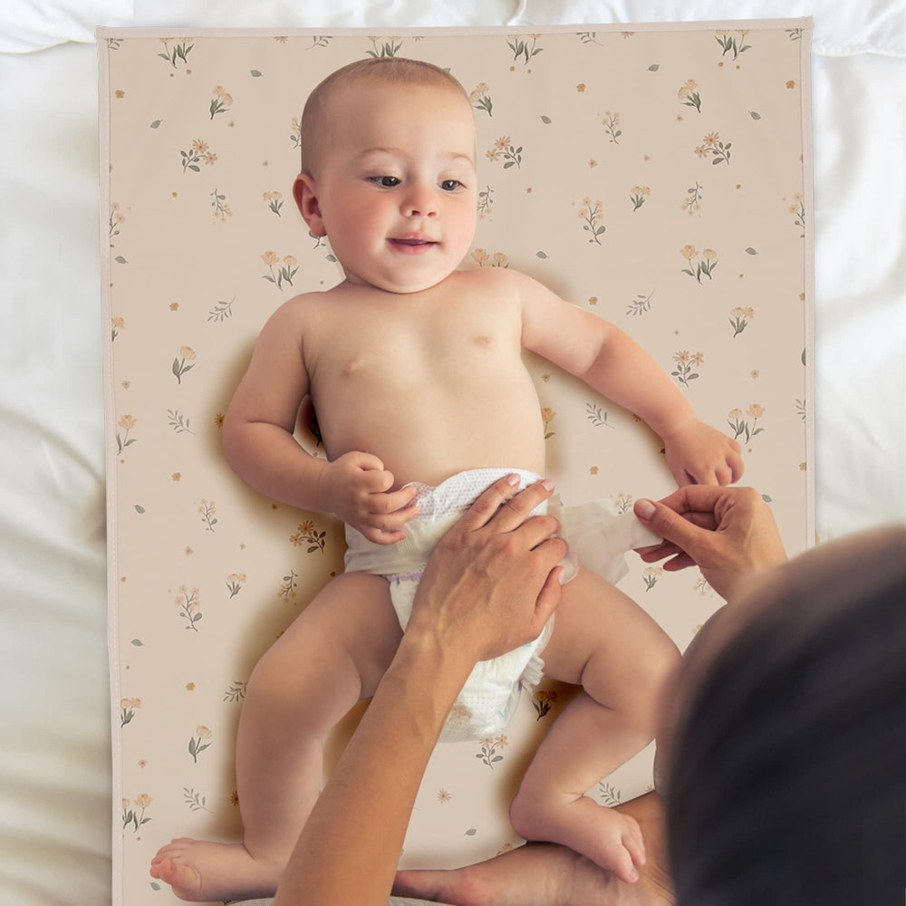 Phoebus Baby changing mat folds for on-the-go diaper changes.