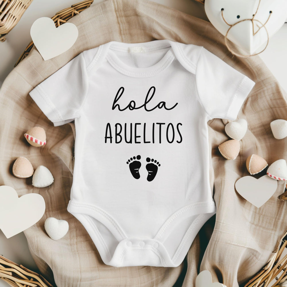 Pineapple Pancake Kids Hola Abuelitos bodysuit flat lay—cute photo prop for baby announcements.