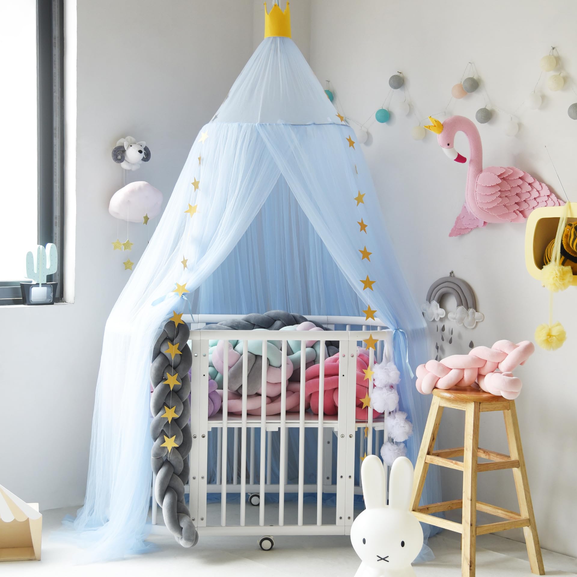 Pinkrin blue crib canopy with soft tulle creating a dreamy, airy space