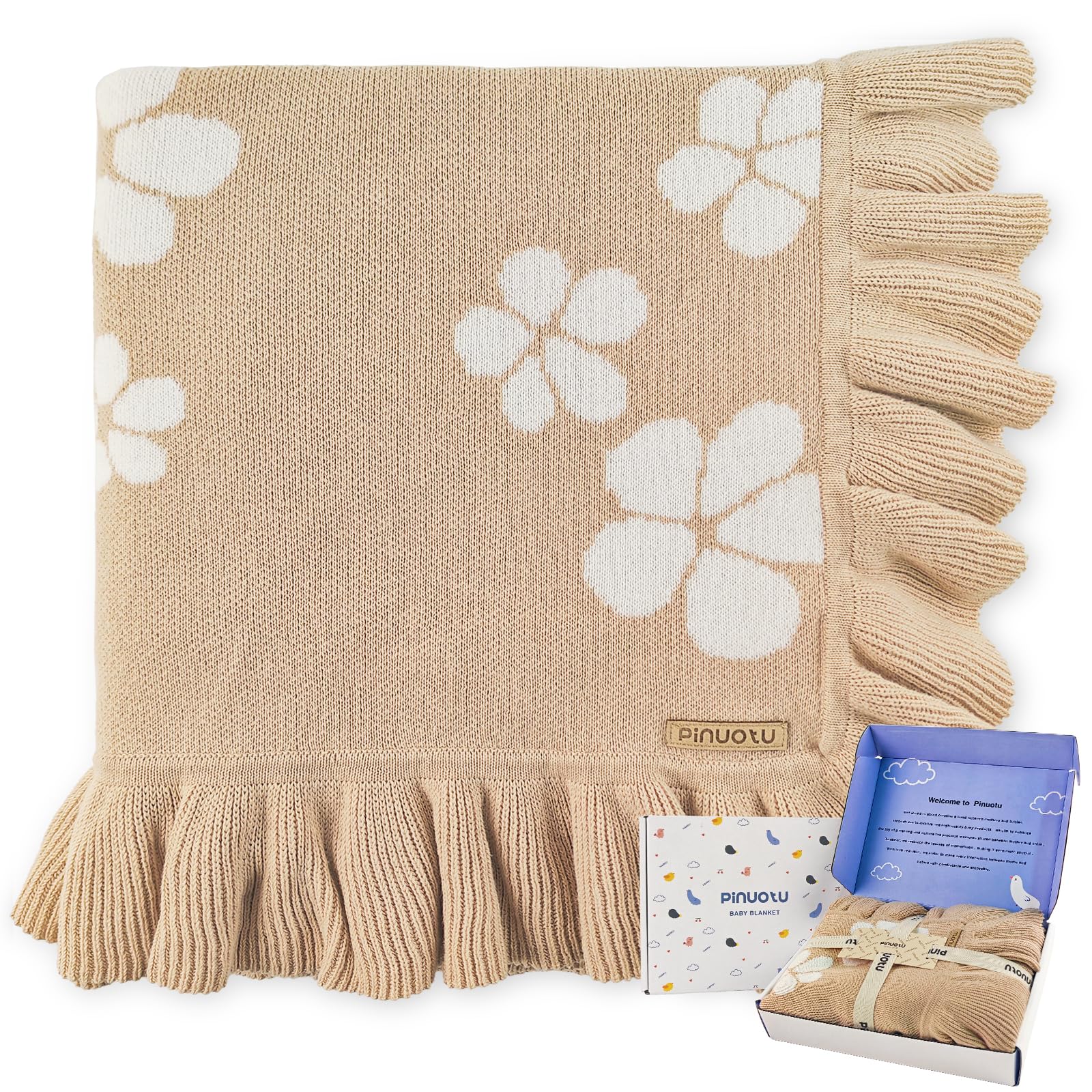 Pinuotu cotton baby blanket with ruffled edges provides gentle warmth and comfort.