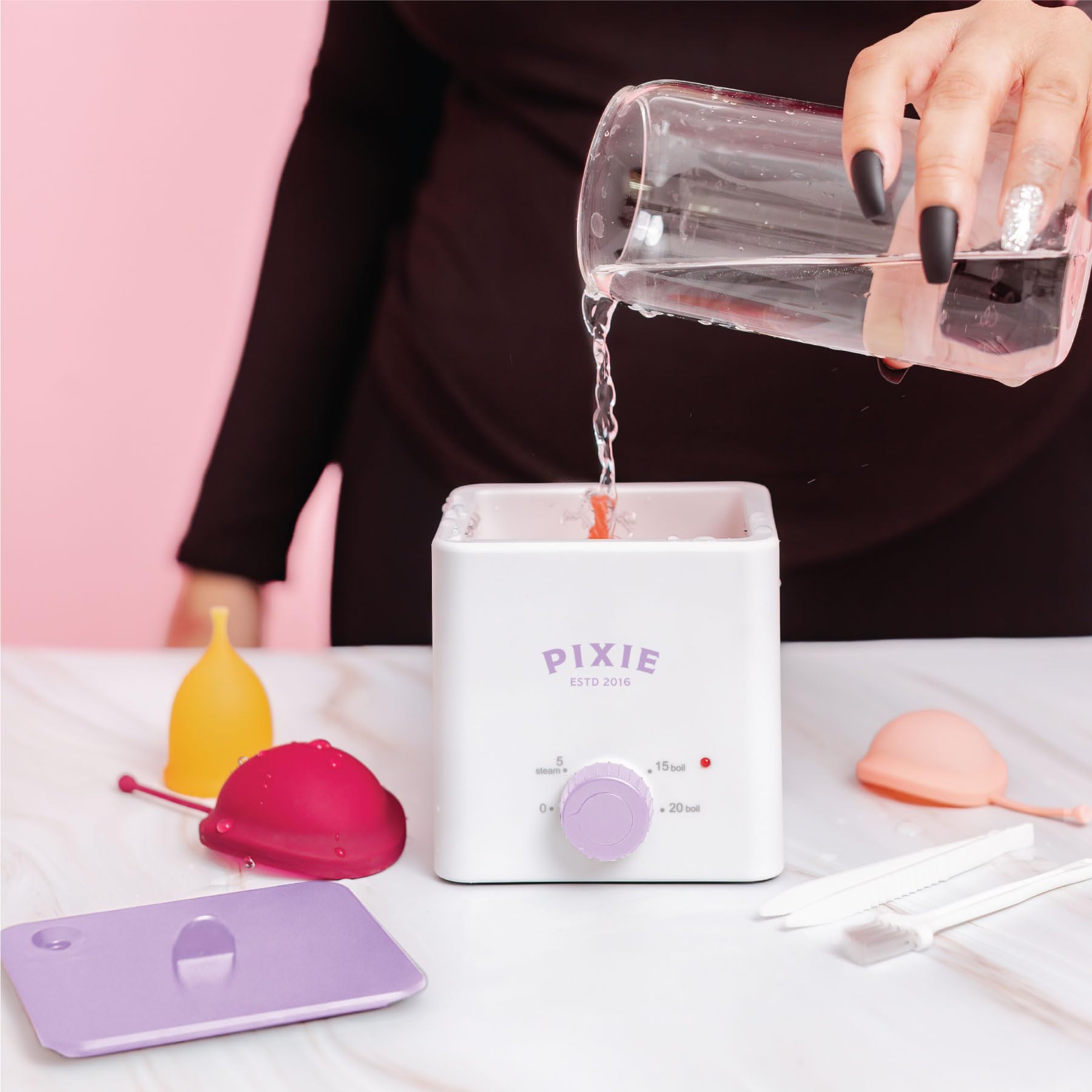 Pixie Cup boiler sterilizer in a dorm room setting for discreet cleaning