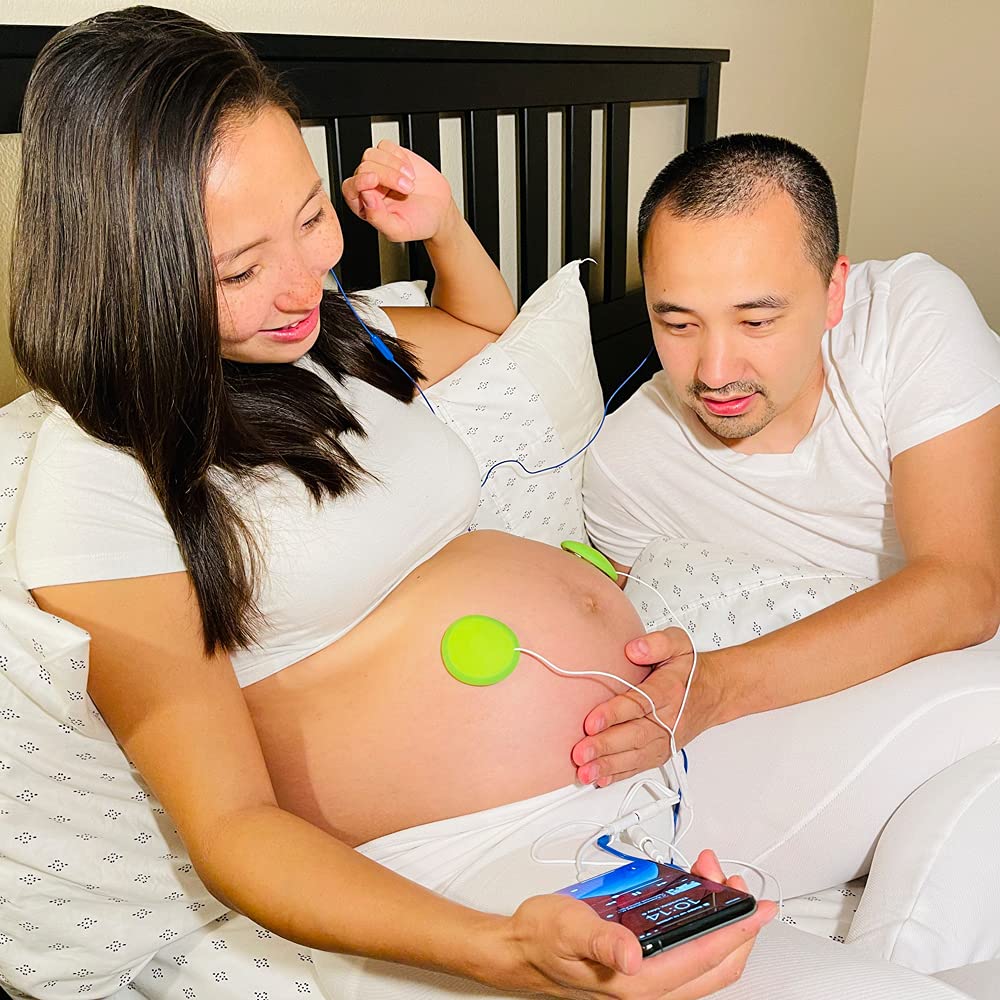 Pixie Tunes baby bump headphones green in-use scene to share soothing sounds with baby
