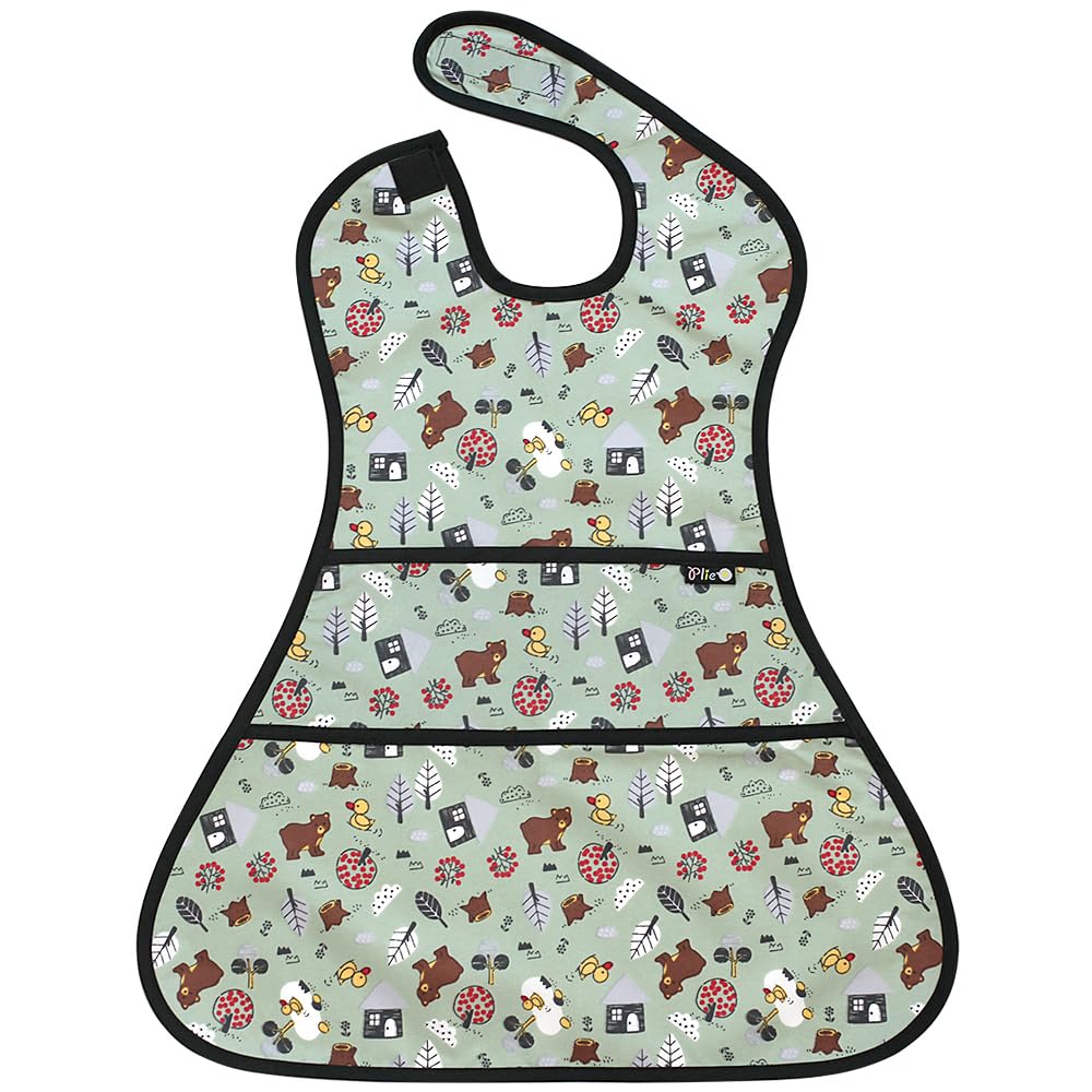 Plie full coverage bib with bear print worn by toddler during mealtime for mess protection.