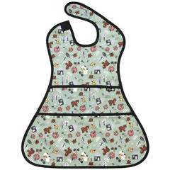 Plie full coverage bib with bear print worn by toddler during mealtime for mess protection.