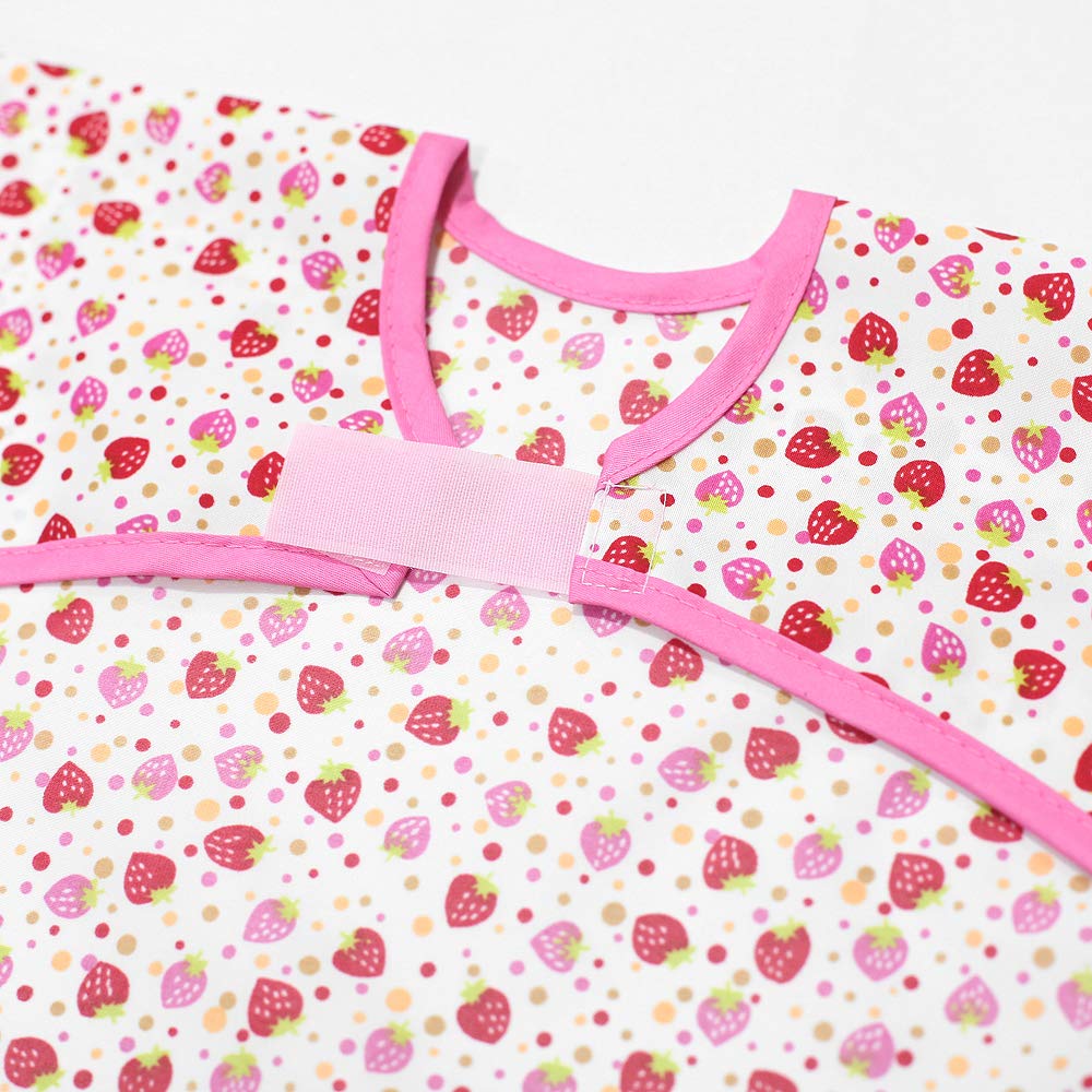 Plie bib waterproof fabric surface demonstrated during toddler feeding for easy cleaning.
