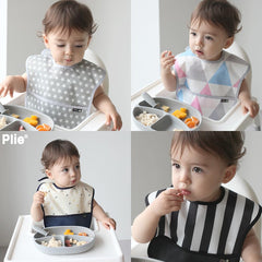 Plie bib with front pocket catching spills