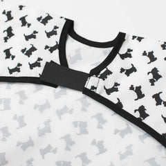Plie long sleeve bib featuring a cotton-trimmed neck for gentle skin contact.