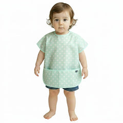 Plie short sleeve waterproof bib in baby blue dots protects clothing during meals.