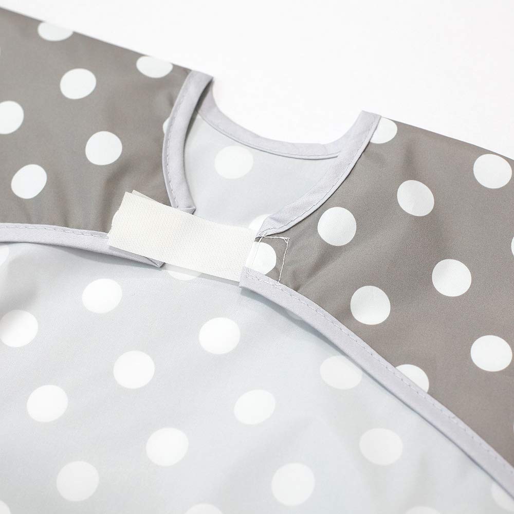 Plie gray dot bib pocket designed to catch crumbs and drips during feeding