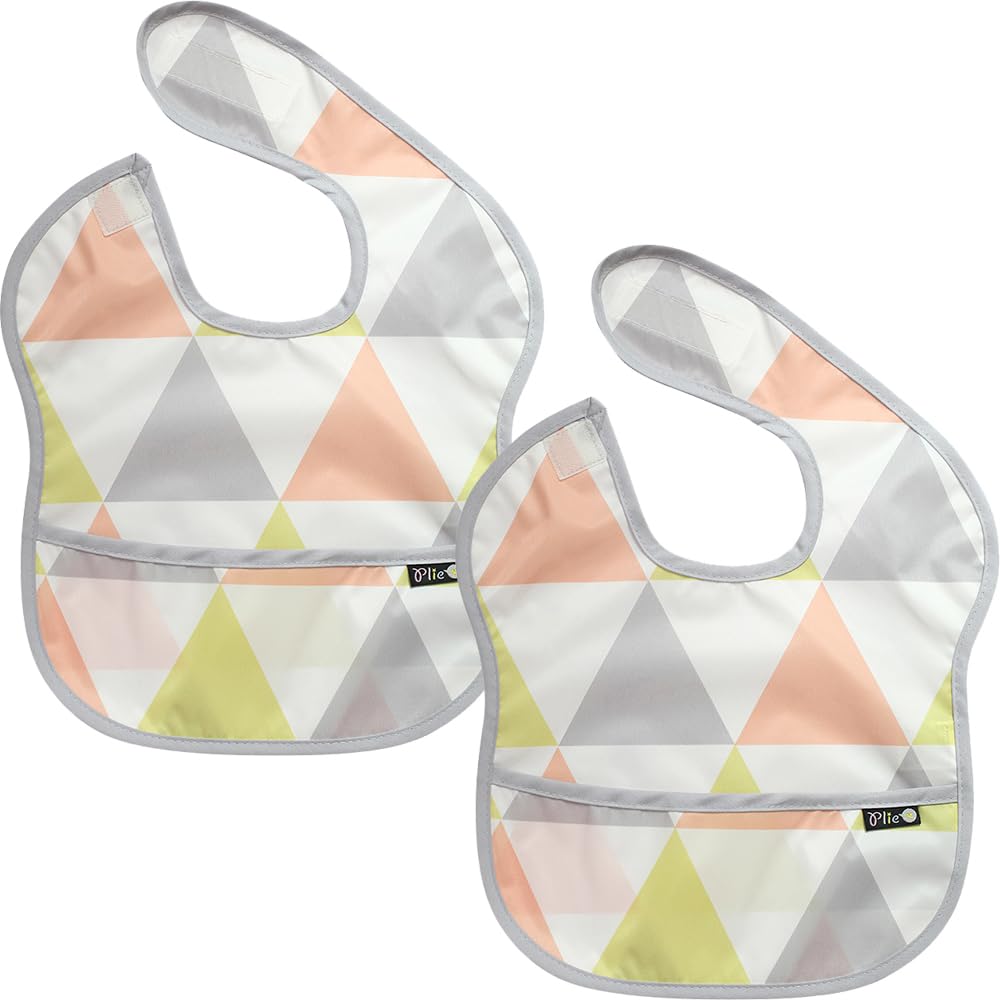 Plie waterproof baby bib with front pocket catching spills during meals