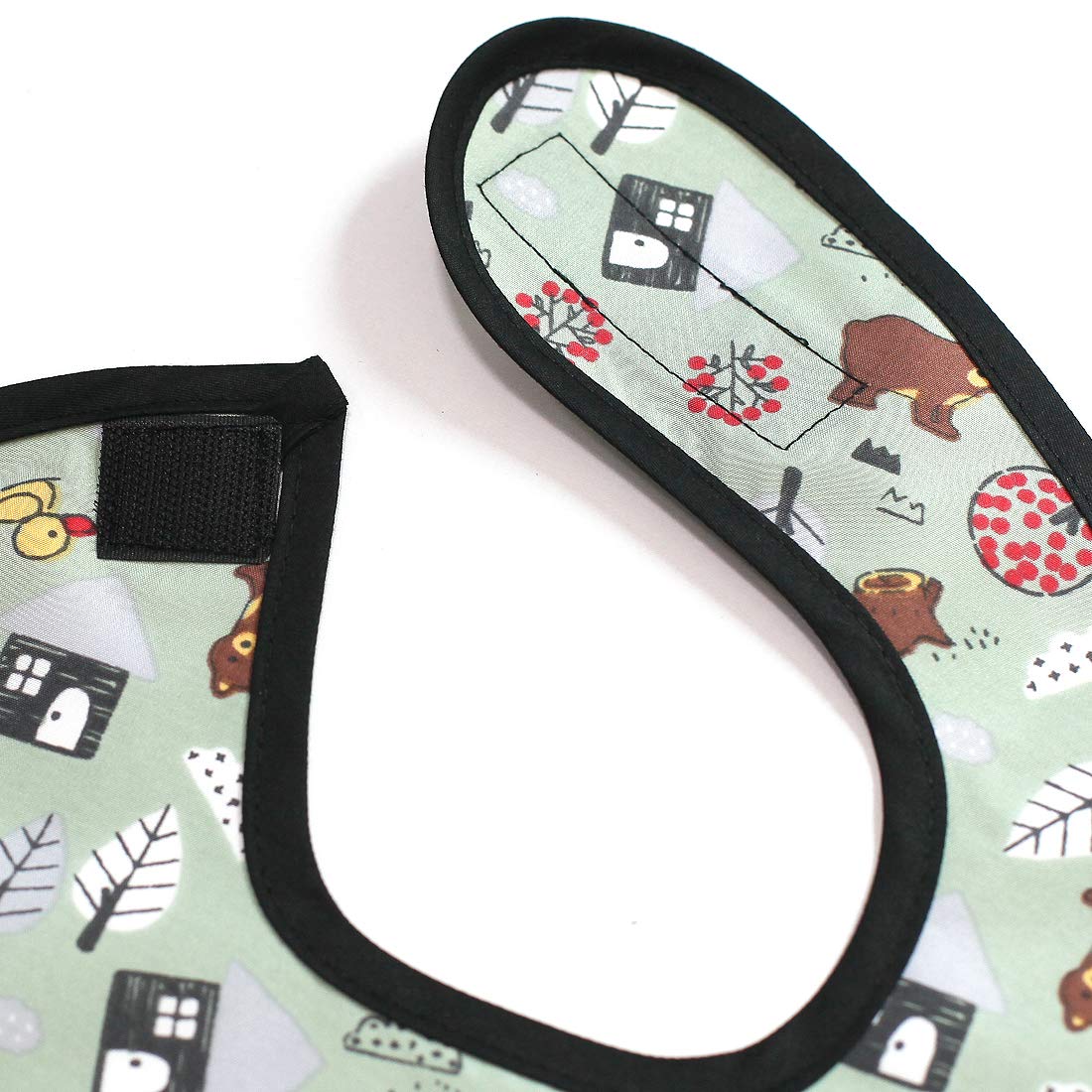 Plie waterproof bib shown with wipeable surface for easy cleaning after meals.