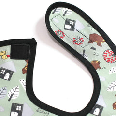 Plie waterproof bib shown with wipeable surface for easy cleaning after meals.