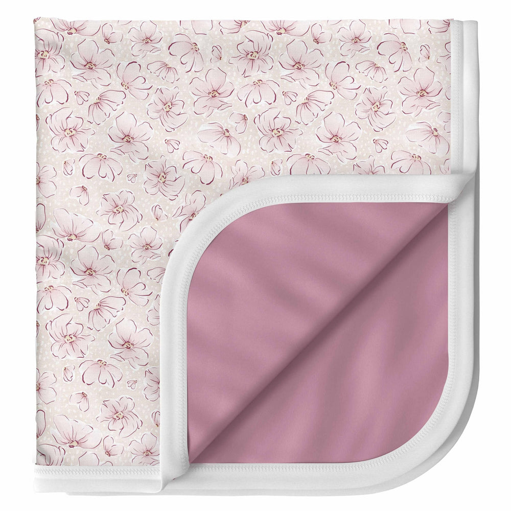 Pobibaby Blossom blanket texture close-up shows soft, stretchy knit for cozy swaddling.