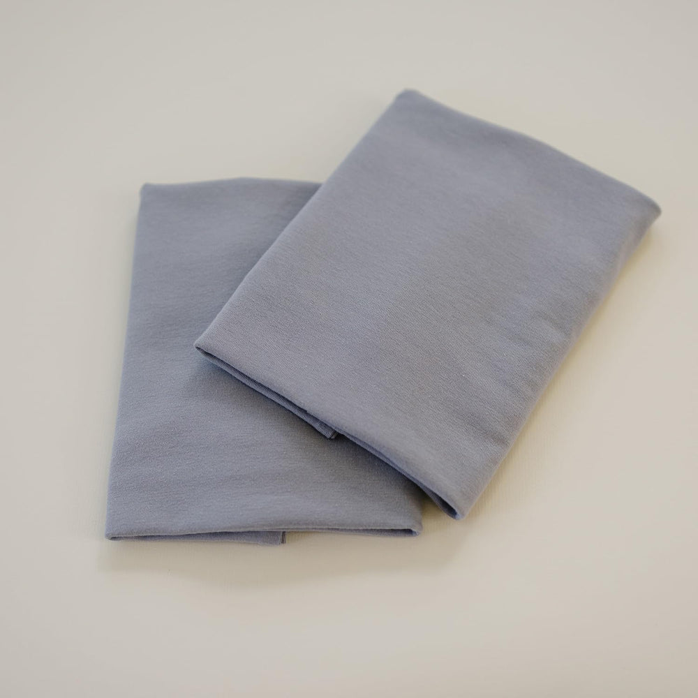 Coordinating Pobibaby nursery essentials help create a cohesive sleep space.