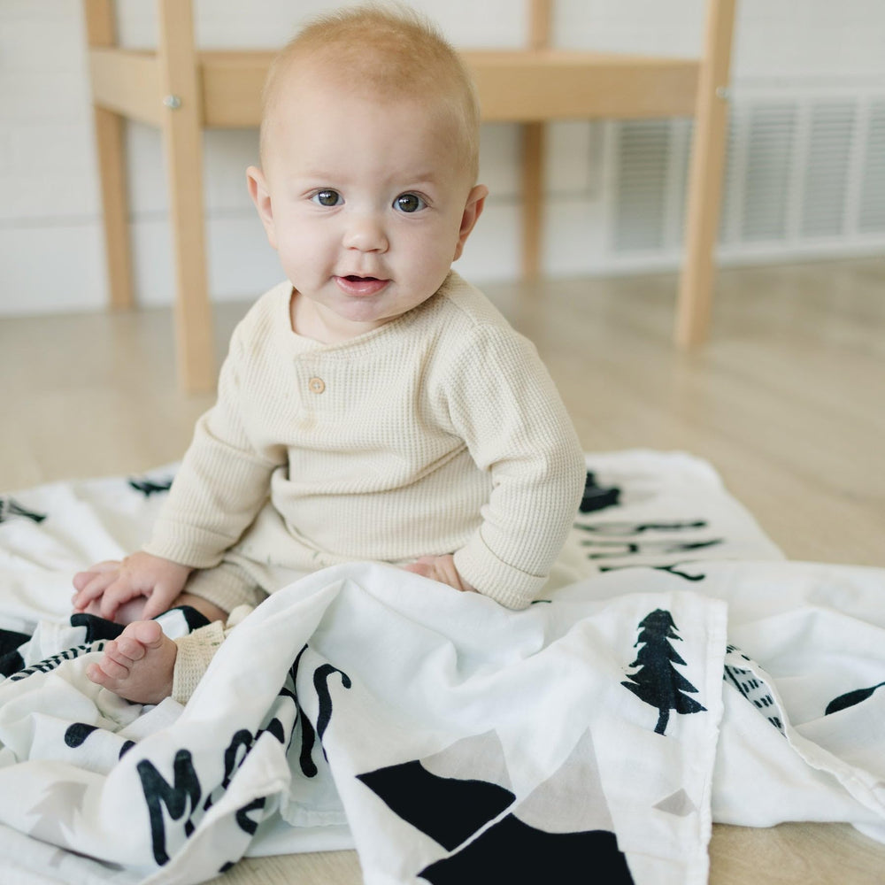 Pondering Pine blanket used as nursery play mat and swaddle