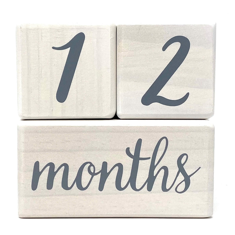 Pondering Pine milestone blocks closeup with rounded corners for baby-friendly design.