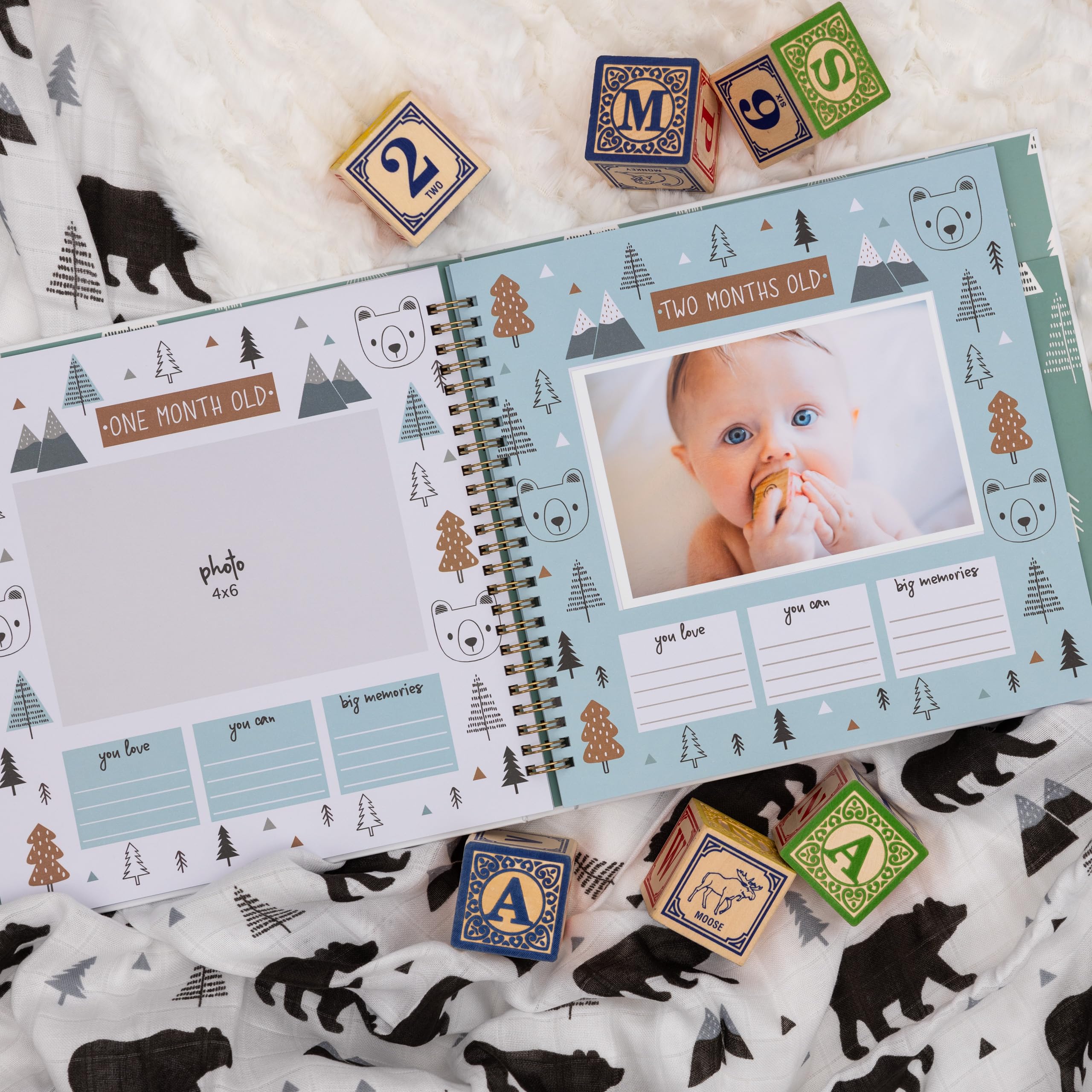 Pondering Pine memory book monthly milestones page tracks growth and moments.