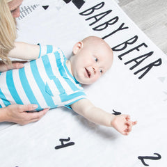 Newborn announcement disc from Pondering Pine with cozy blanket