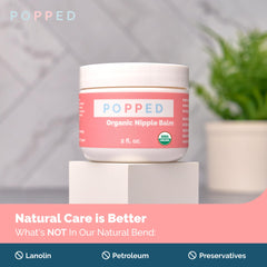 Popped Organic Nipple Butter being applied to skin for comfort.