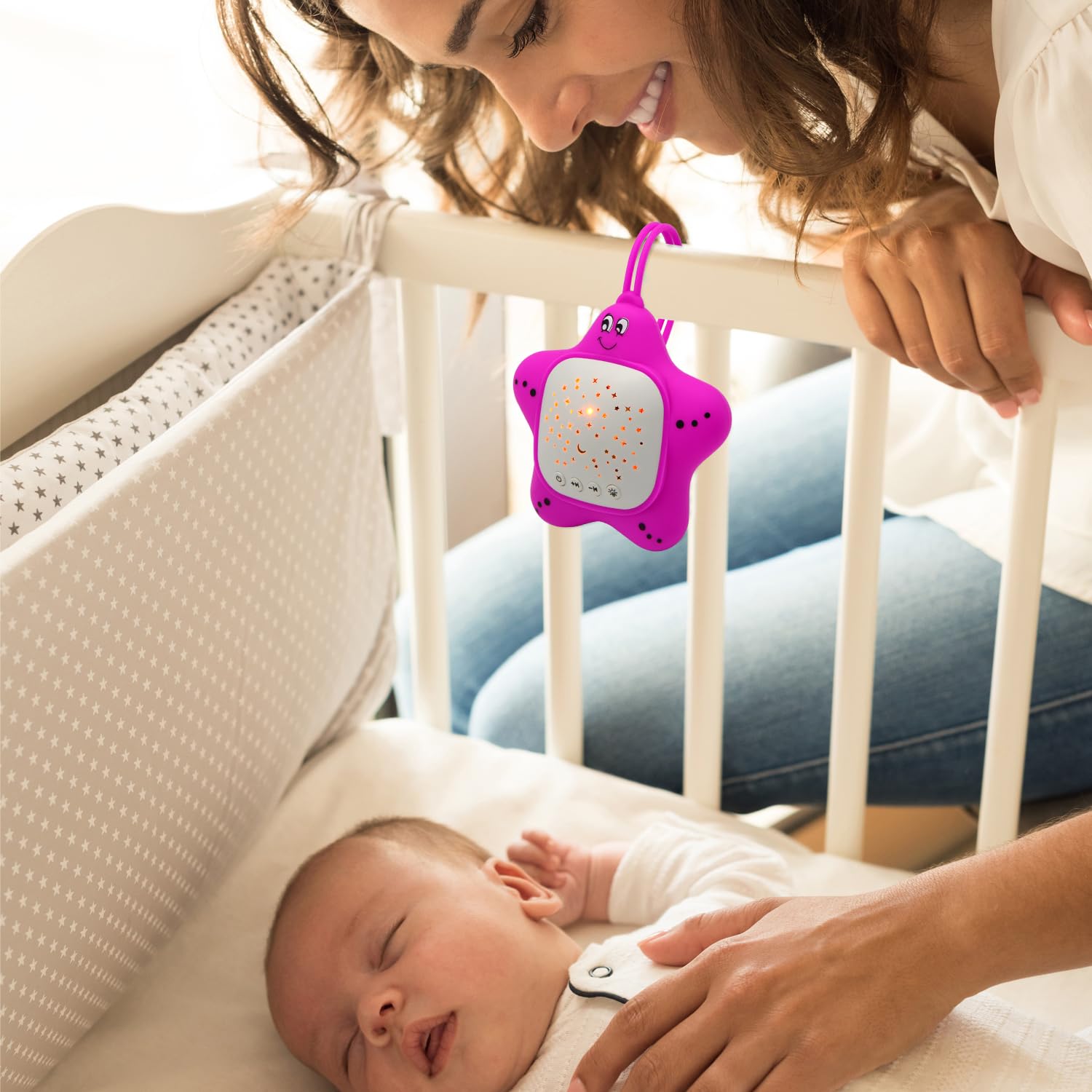 Baby sleeping with sound and light features in use on Portable Baby device.