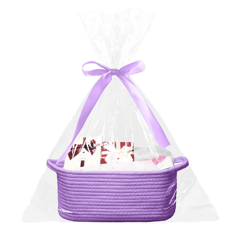Poschnor baby gift basket in purple wrap, ready for gifting.
