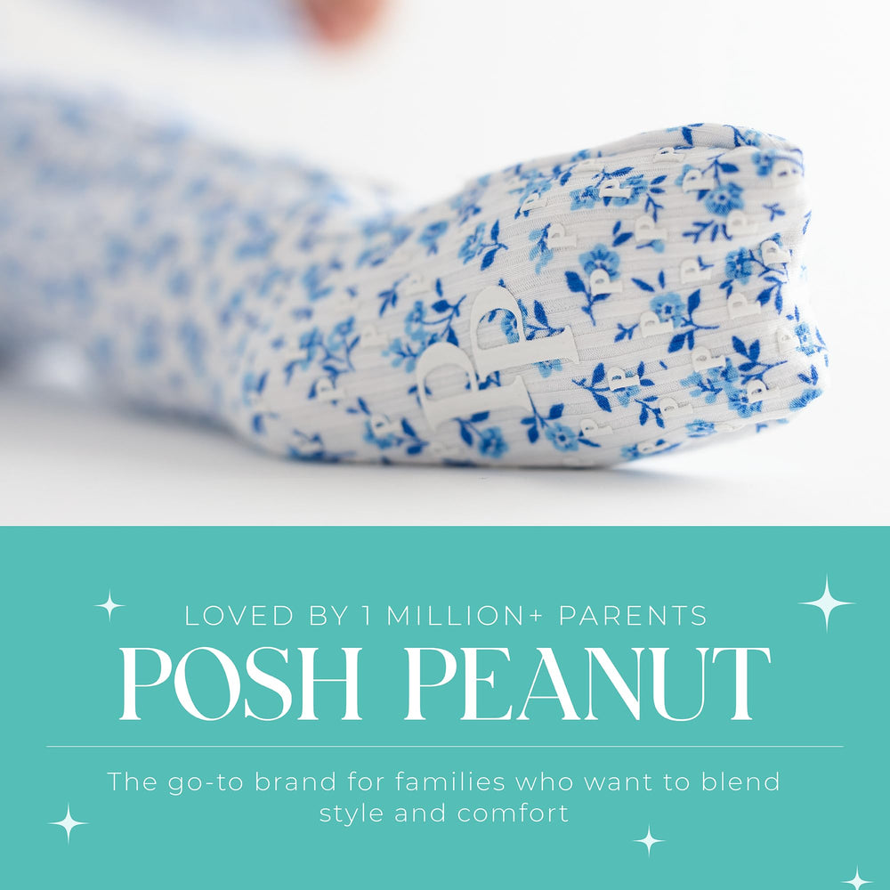 Toddler wearing footless mode to show versatile zipper design for night-time changes.