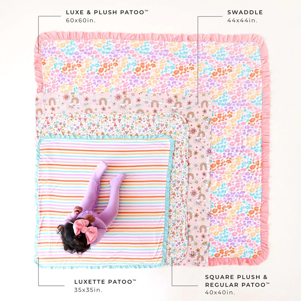 Posh Peanut Patoo blanket with ruffled edge adds gentle charm to nap routines.